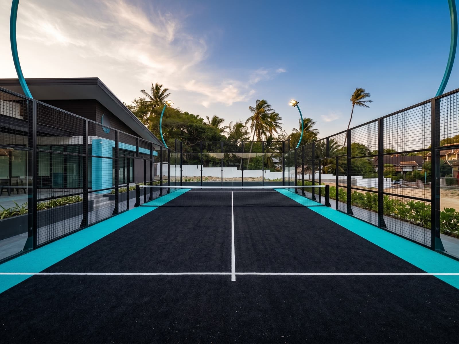 The narrow one-on-one training court, looking down its length at sunset
